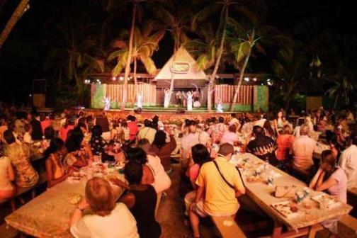 a group of people sitting at a table in a restaurant
