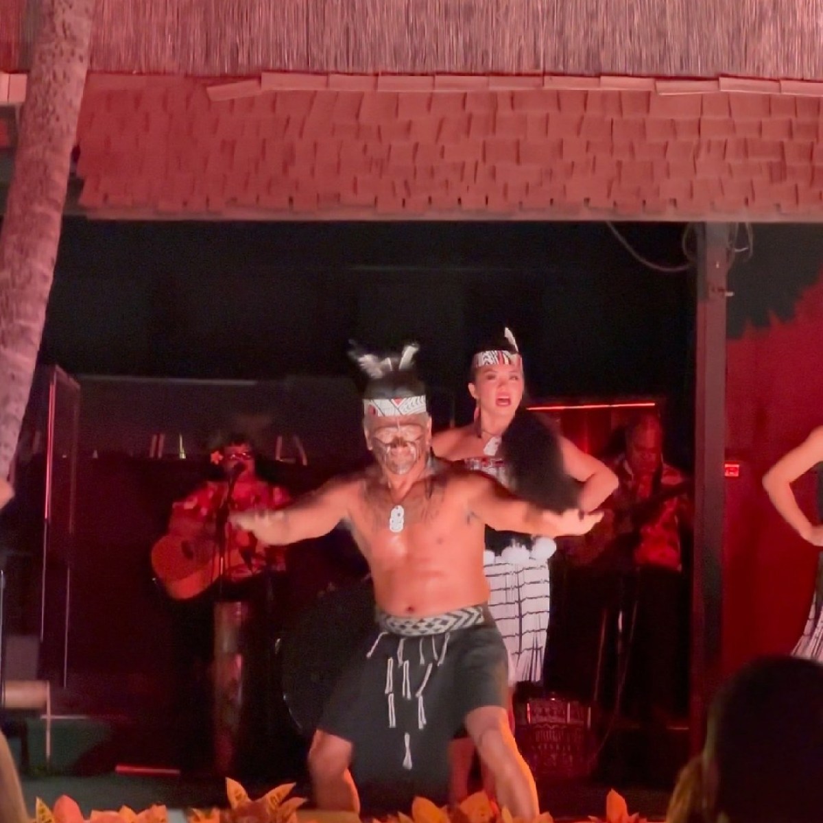 a person standing in front of a birthday cake