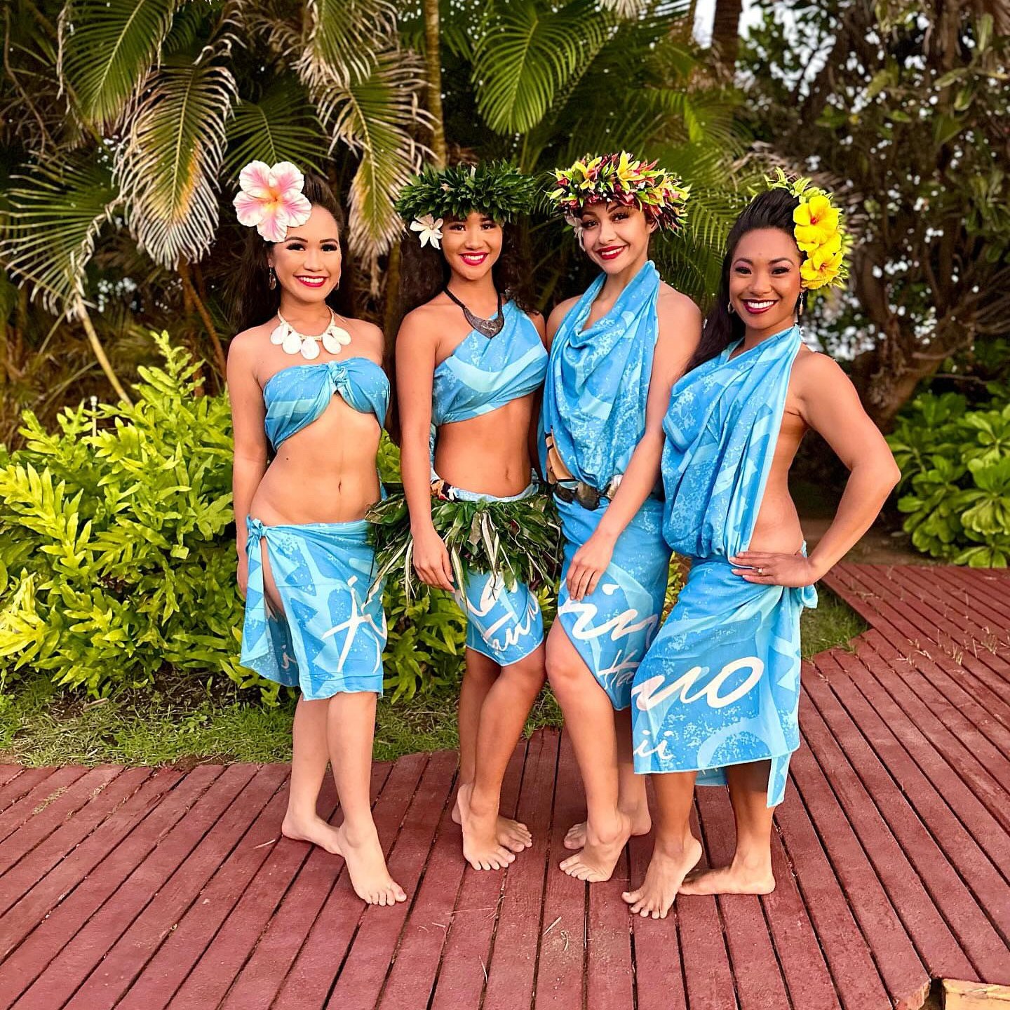 Crystal Colar et al. standing in front of a tree posing for the camera