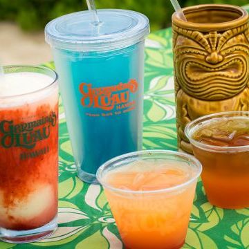 a cup of coffee and a glass of beer on a table