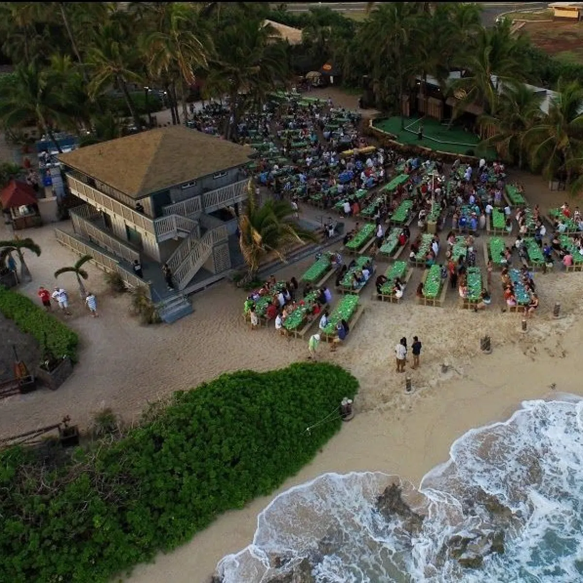 a person sitting on the side of a river