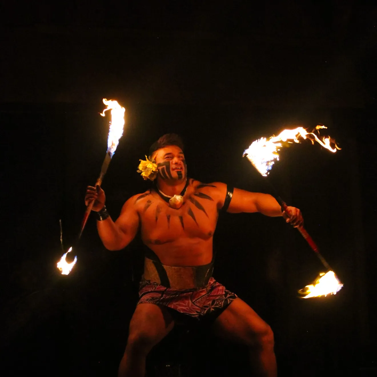 a person standing in front of a fire