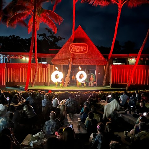 a group of people standing in front of a crowd